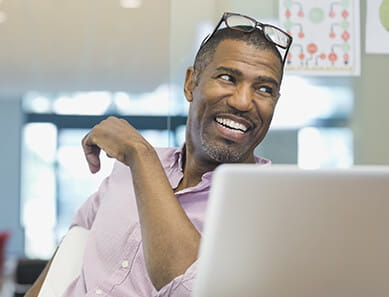 Businessman looking away at office desk